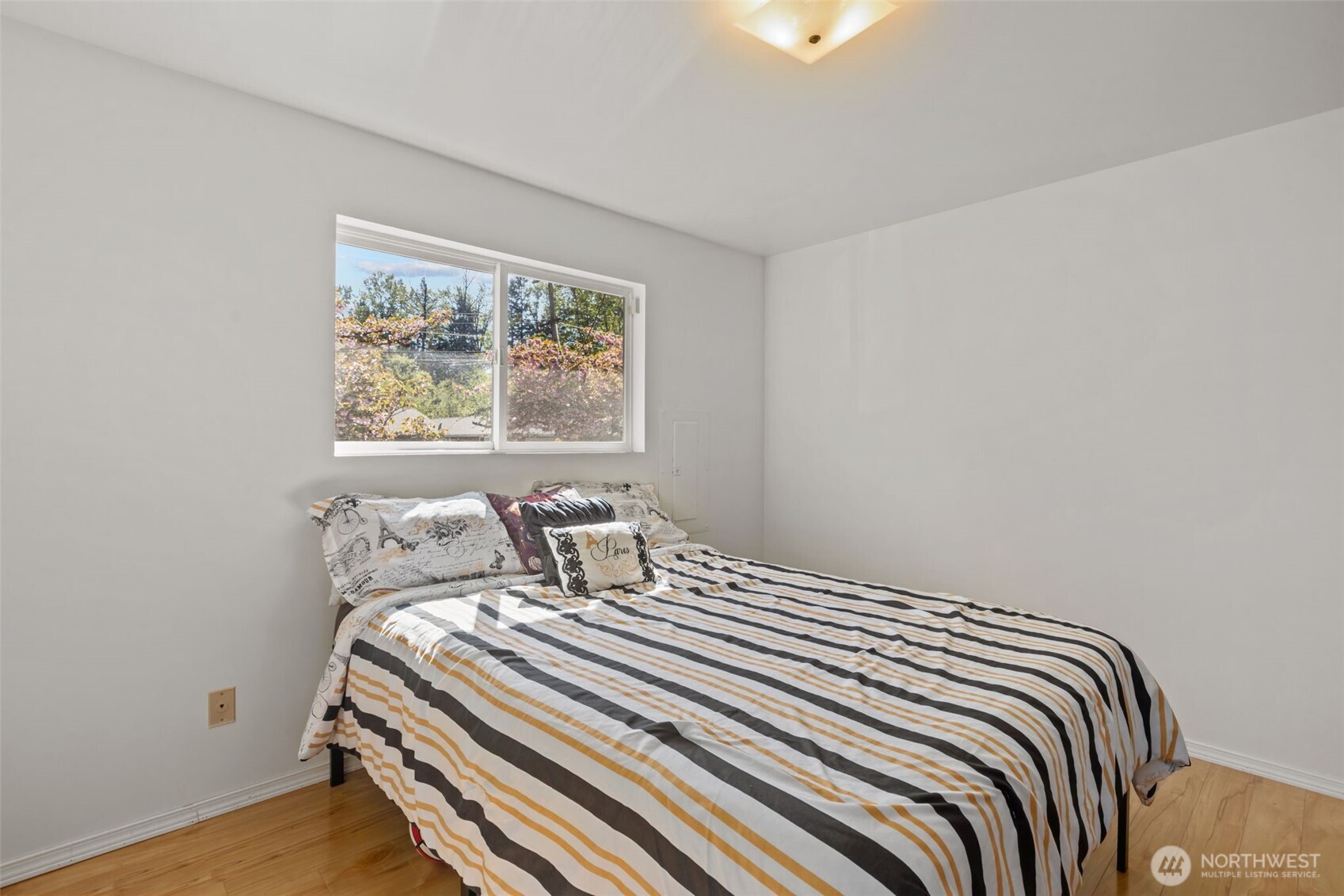 16022 126th Avenue Southeast Renton, WA 98058 - Photo 15 of 35 a bedroom with a bed and a window