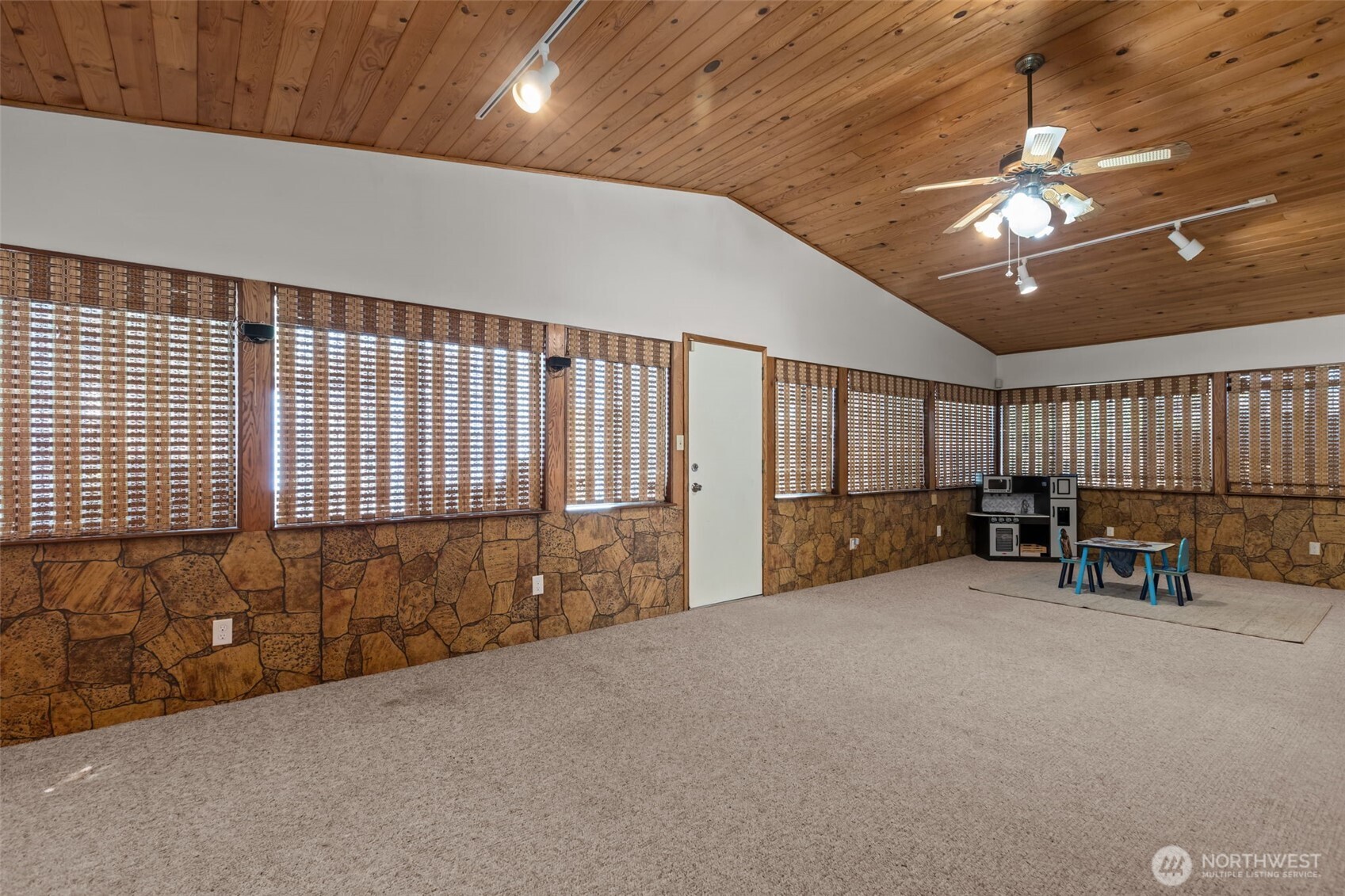 16022 126th Avenue Southeast Renton, WA 98058 - Photo 22 of 35 a view of an empty room with wooden floor