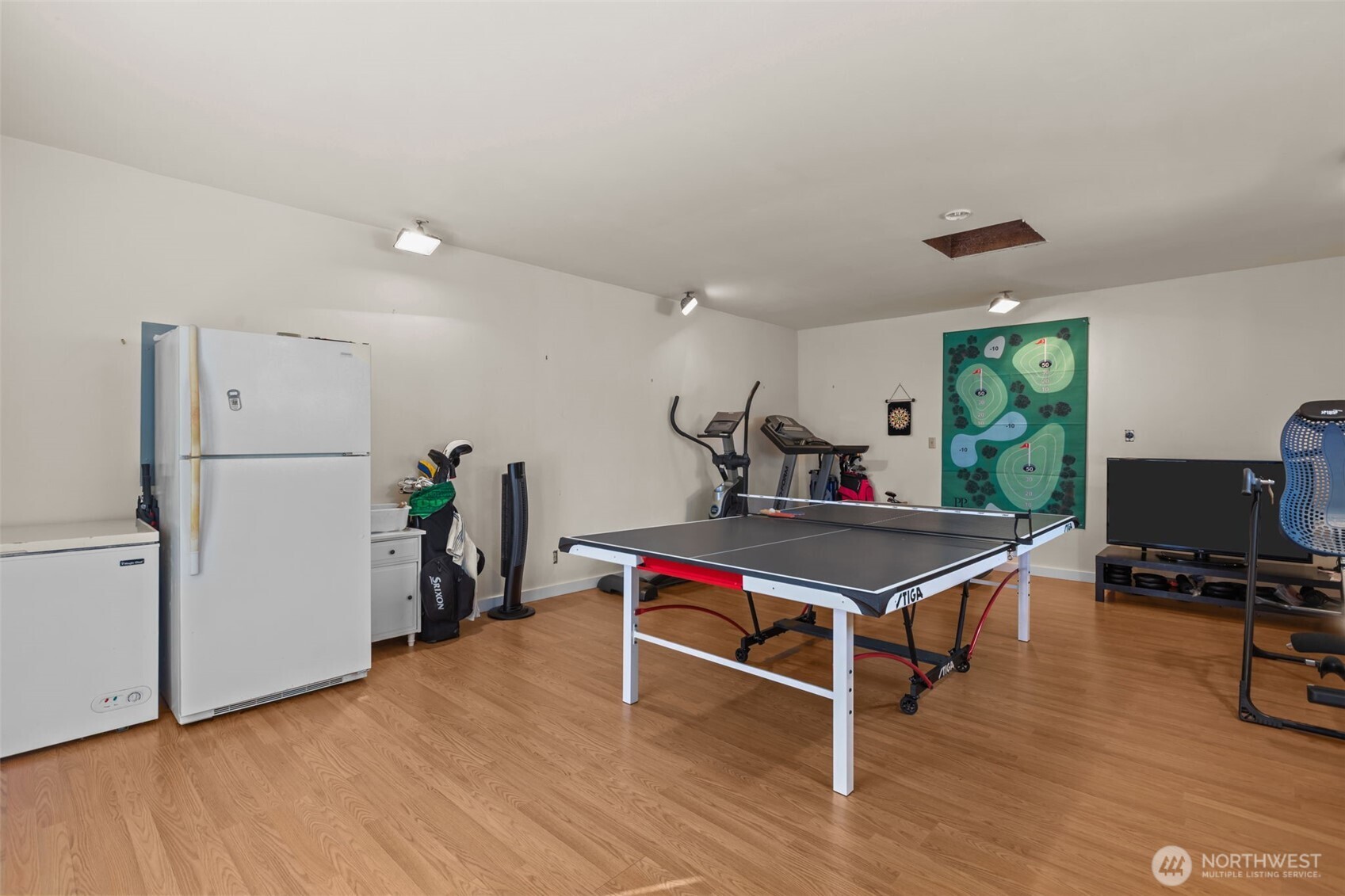 16022 126th Avenue Southeast Renton, WA 98058 - Photo 24 of 35 a room with furniture and wooden floor