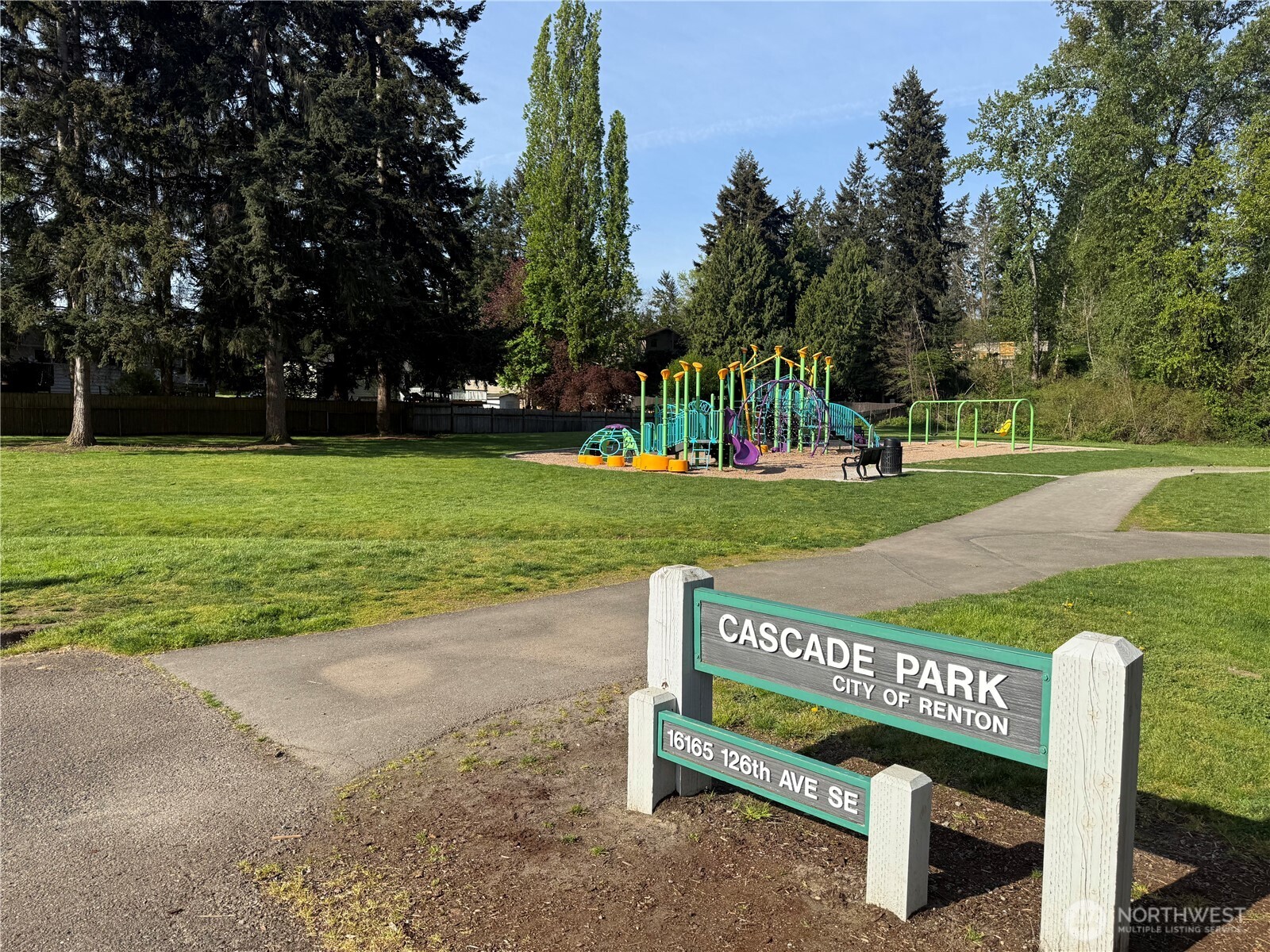 16022 126th Avenue Southeast Renton, WA 98058 - Photo 34 of 35 a view of a wooden bench sitting in a park