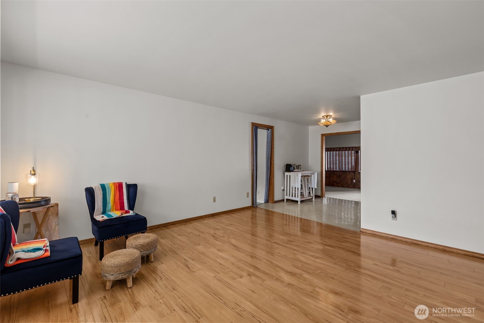 16022 126th Avenue Southeast Renton, WA 98058 - Photo 4 of 35 a living room with furniture and a wooden floor
