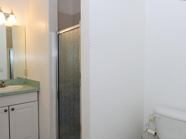 12557 154th Road North Jupiter, FL 33478 - Photo 22 of 38 a bathroom with a granite countertop sink and a toilet