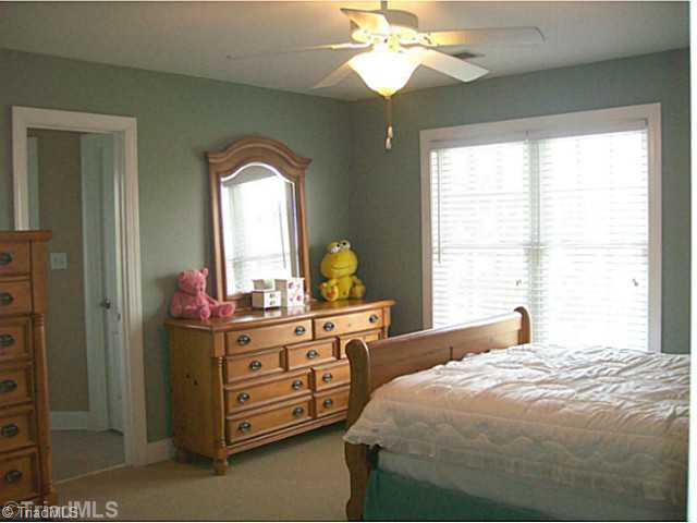 5700 Mabe Drive Oak Ridge, NC 27310 - Photo 13 of 16 2nd Bedroom. All bedrooms have private access to baths and abundant closet space.