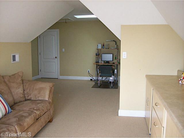 5700 Mabe Drive Oak Ridge, NC 27310 - Photo 14 of 16 Bonus. Many alcoves allows for many uses. Couch and cabinetry remain.