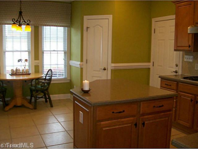 5700 Mabe Drive Oak Ridge, NC 27310 - Photo 8 of 16 Breakfast. Cozy breakfast space in kitchen with widows to enjoy your morning coffee.