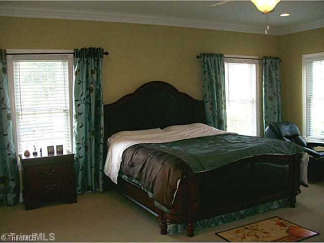5700 Mabe Drive Oak Ridge, NC 27310 - Photo 10 of 16 Master Bedroom. Sizable master bedroom on main with nice natural light.