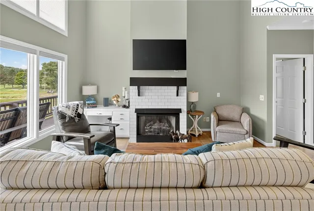 a bedroom with a bed and a fireplace