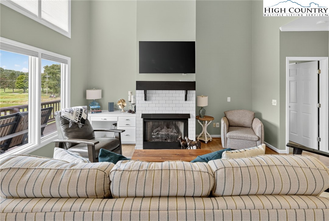 233 Lakeview Place, Unit D2 Jefferson, NC 28640 - Photo 13 of 49 a bedroom with a bed and a fireplace