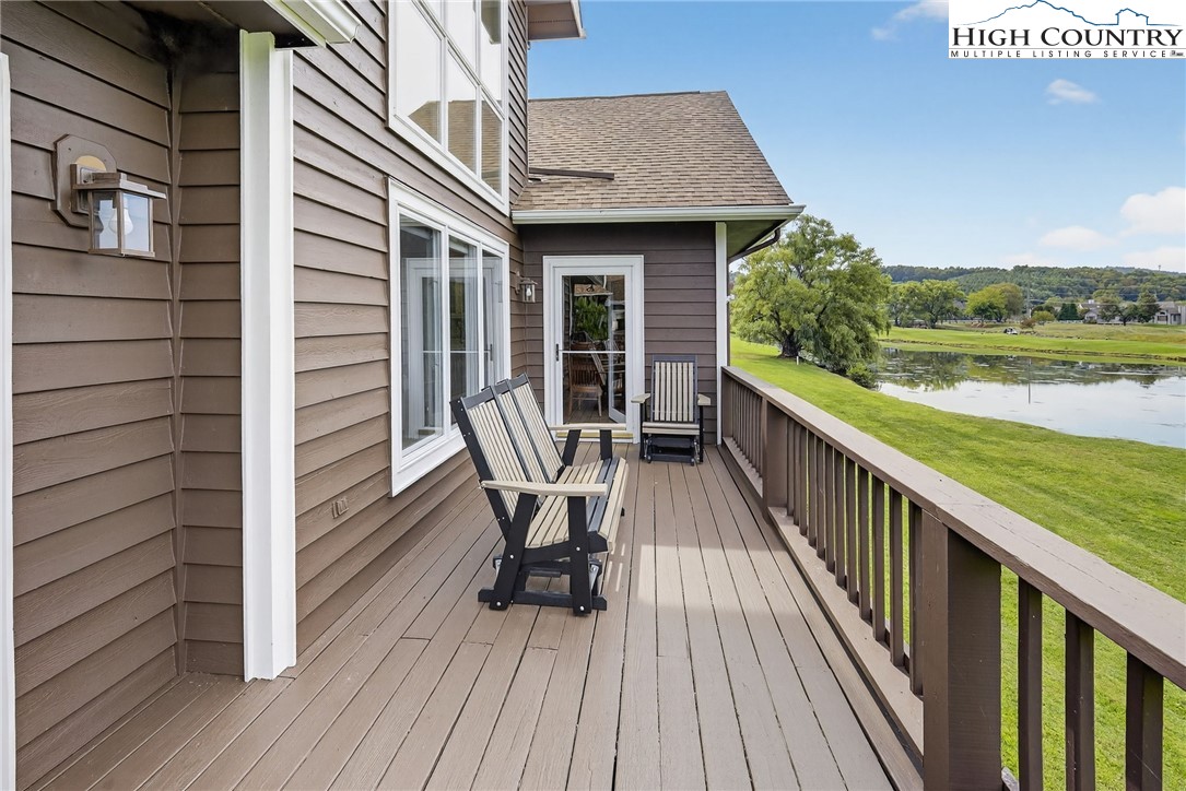 233 Lakeview Place, Unit D2 Jefferson, NC 28640 - Photo 18 of 49 a view of balcony with furniture and wooden floor