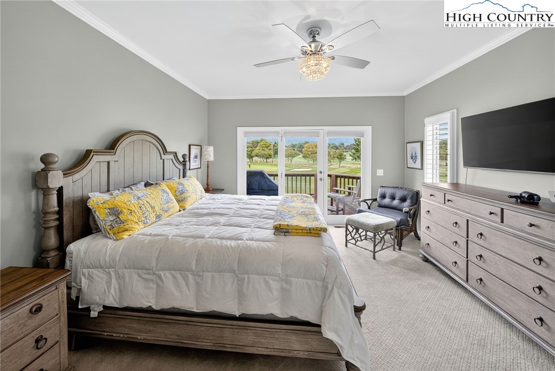 233 Lakeview Place, Unit D2 Jefferson, NC 28640 - Photo 19 of 49 a bedroom with a bed and a flat screen tv