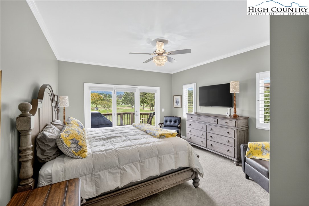 233 Lakeview Place, Unit D2 Jefferson, NC 28640 - Photo 22 of 49 a bedroom with a bed and a flat screen tv