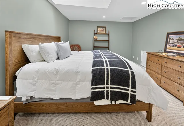 a bedroom with a bed and a cabinets