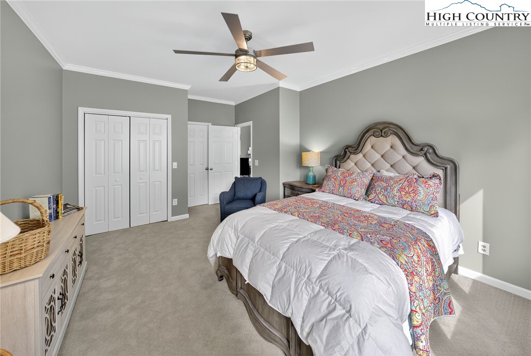 233 Lakeview Place, Unit D2 Jefferson, NC 28640 - Photo 29 of 49 a bedroom with a bed and a ceiling fan