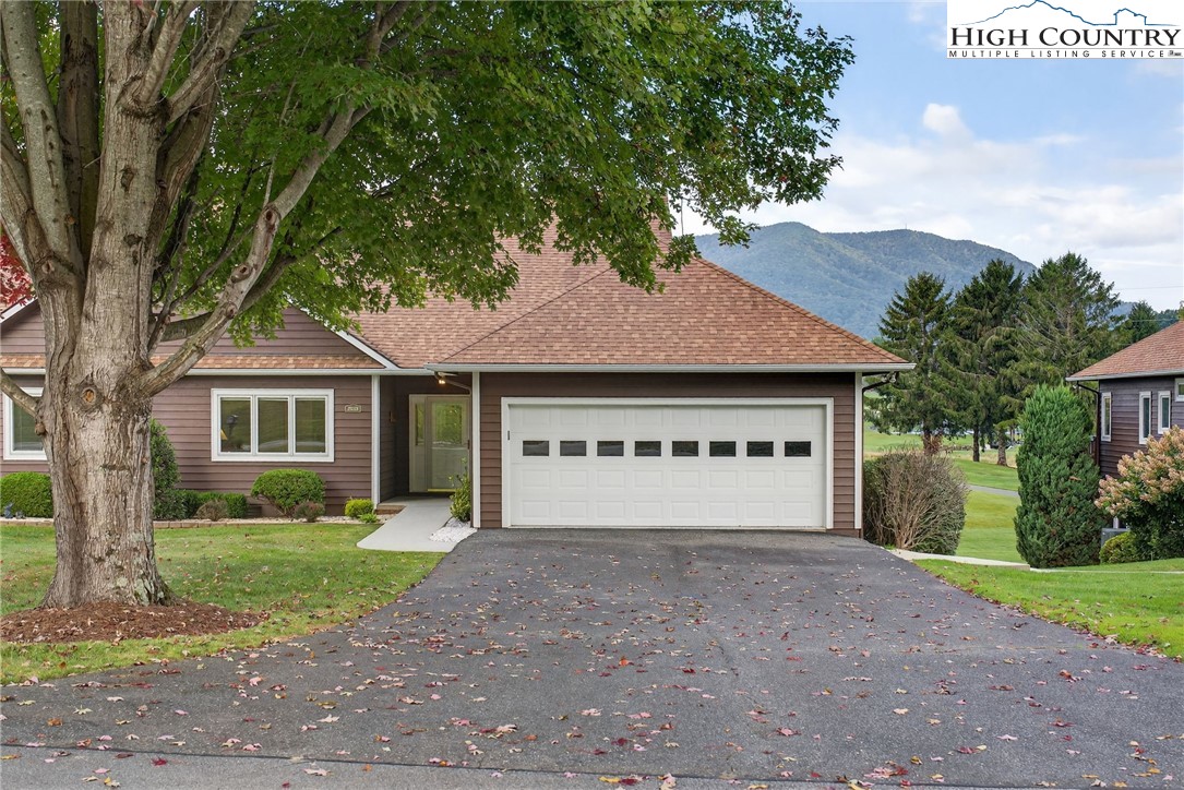 233 Lakeview Place, Unit D2 Jefferson, NC 28640 - Photo 3 of 49 a view of house with yard and a garage