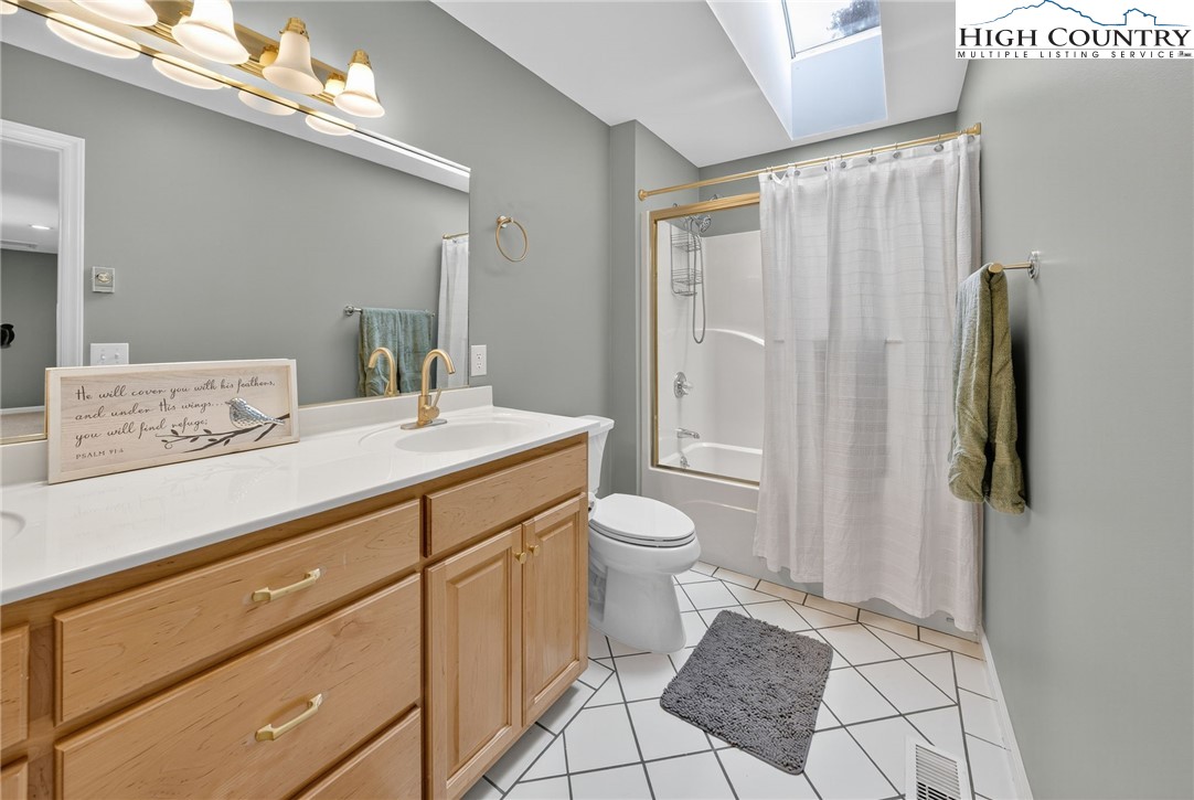 233 Lakeview Place, Unit D2 Jefferson, NC 28640 - Photo 33 of 49 a bathroom with a sink a toilet and shower