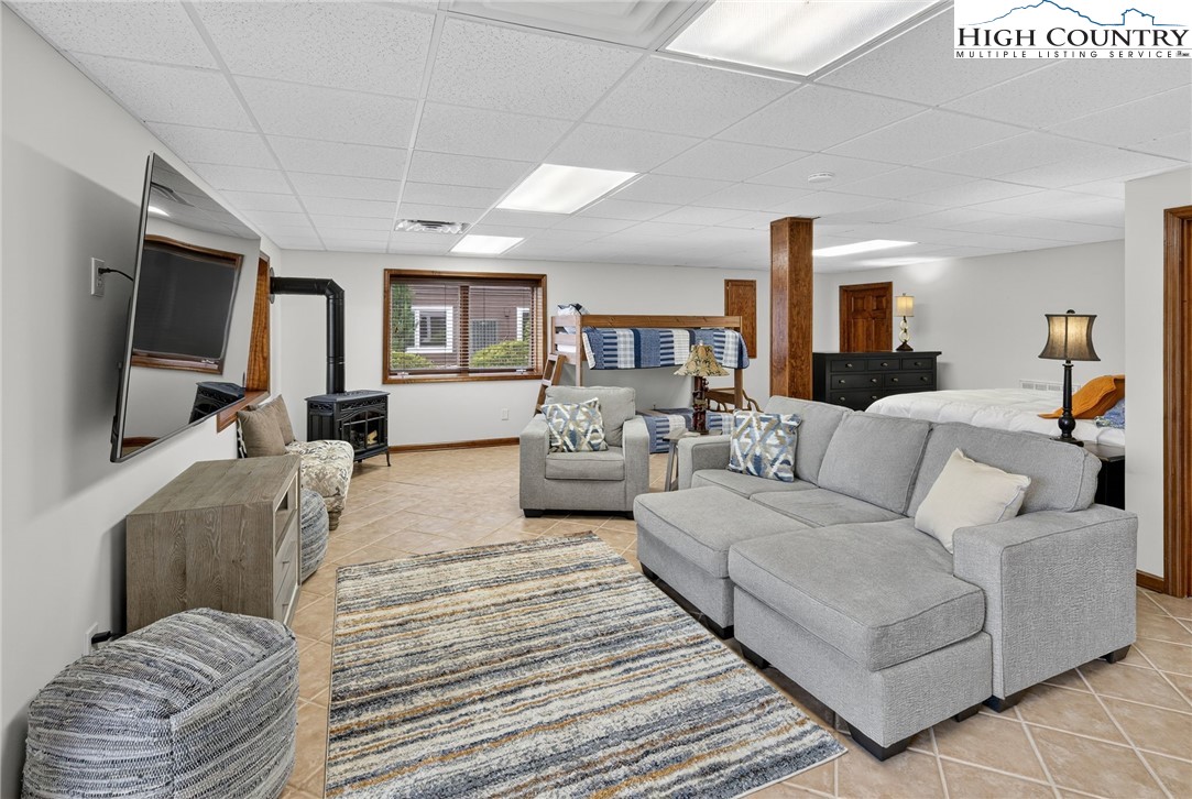 233 Lakeview Place, Unit D2 Jefferson, NC 28640 - Photo 39 of 49 a living room with furniture and a flat screen tv