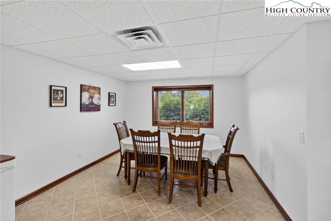 233 Lakeview Place, Unit D2 Jefferson, NC 28640 - Photo 40 of 49 a view of a dining room with furniture and a window