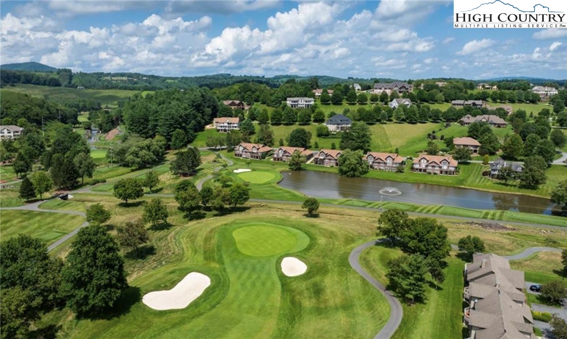 233 Lakeview Place, Unit D2 Jefferson, NC 28640 - Photo 4 of 49 a view of a lake with a yard