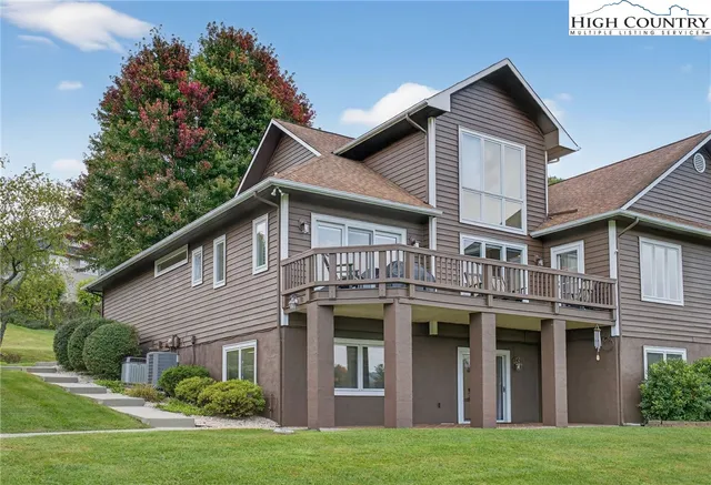 an aerial view of a house with yard swimming pool and outdoor seating