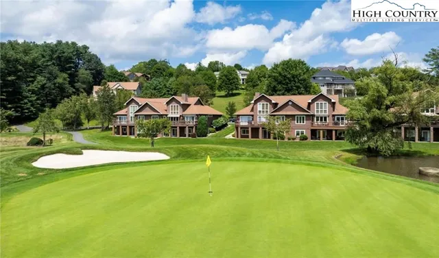 a view of a lake with a yard