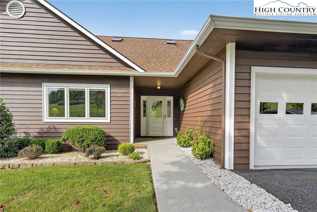 233 Lakeview Place, Unit D2 Jefferson, NC 28640 - Photo 8 of 49 a front view of a house with garden