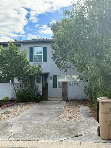 a view of a house with a garden