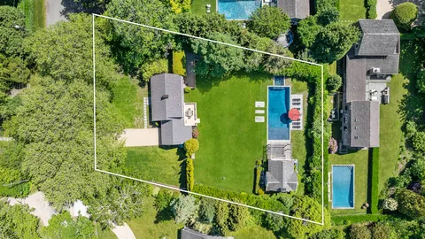 an aerial view of houses with yard
