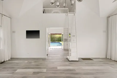 a view of a livingroom with wooden floor