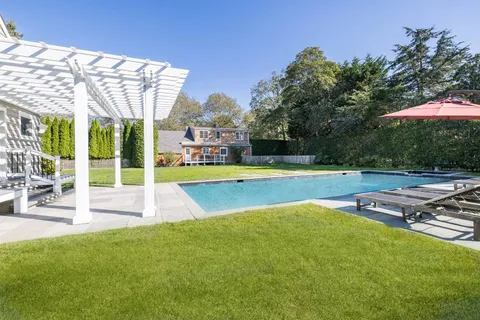 a view of a swimming pool with a patio