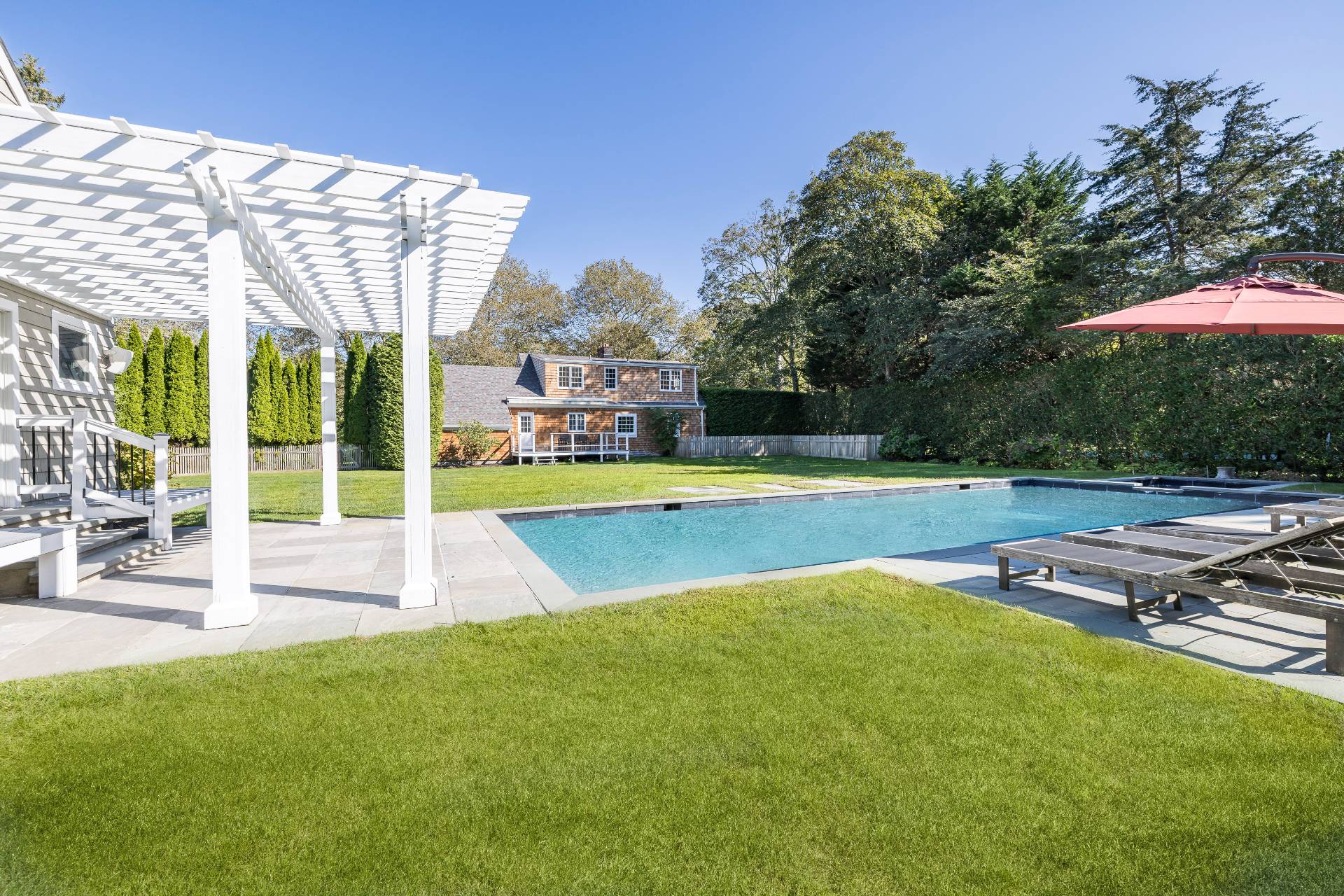 96 Audubon Avenue Bridgehampton, NY 11932 - Photo 24 of 25 a view of a swimming pool with a patio