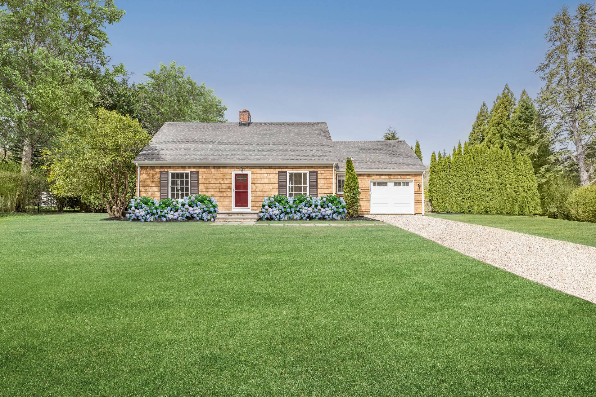 96 Audubon Avenue Bridgehampton, NY 11932 - Photo 6 of 25 a front view of a house with garden