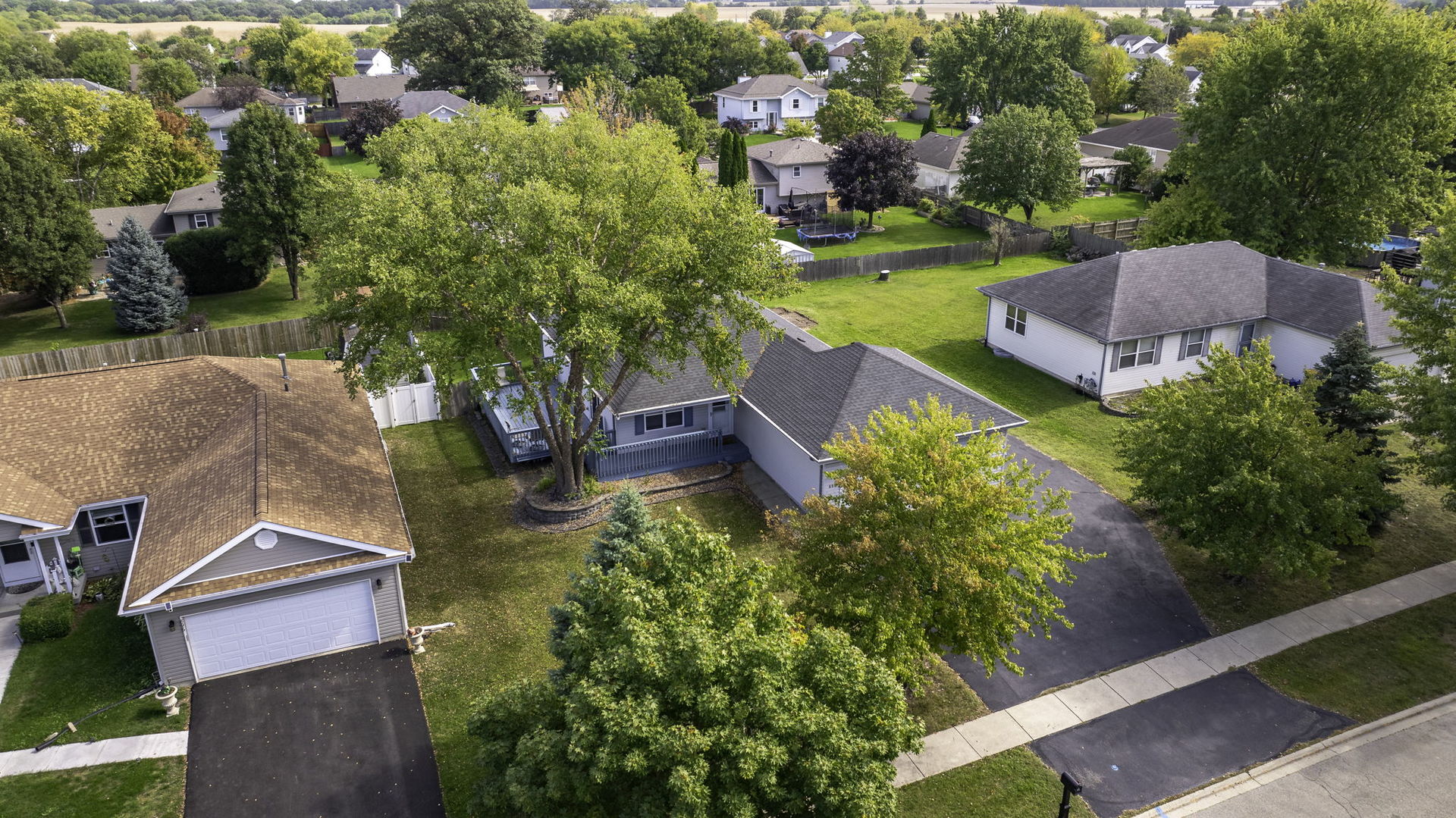 an aerial view of house with yard swimming pool and outdoor seating