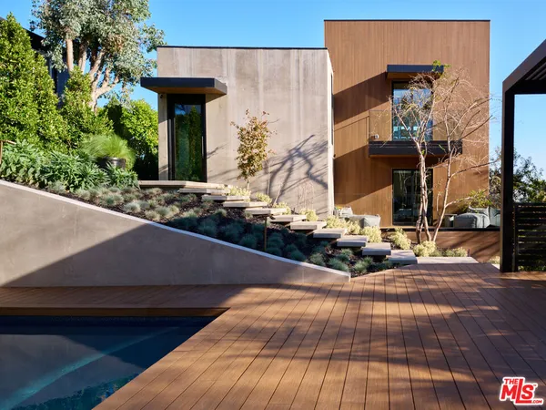 a view of a house with yard and sitting area