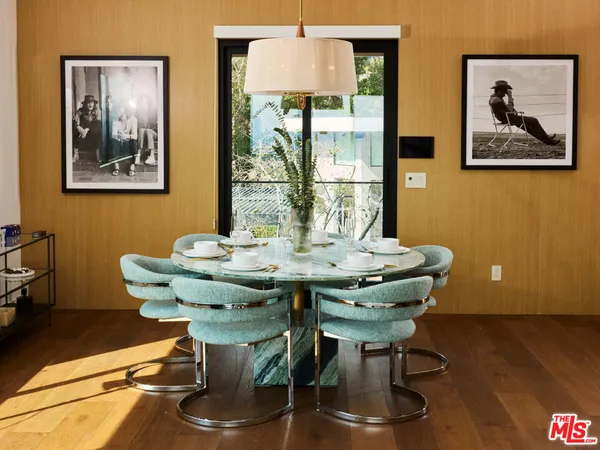 a view of a dining room with furniture window and wooden floor