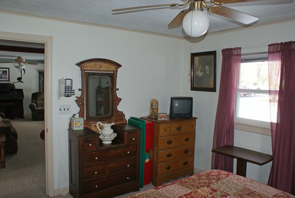 274 Loudville Road Easthampton, MA 01027 - Photo 8 of 30 a bedroom with a bed and a chandelier