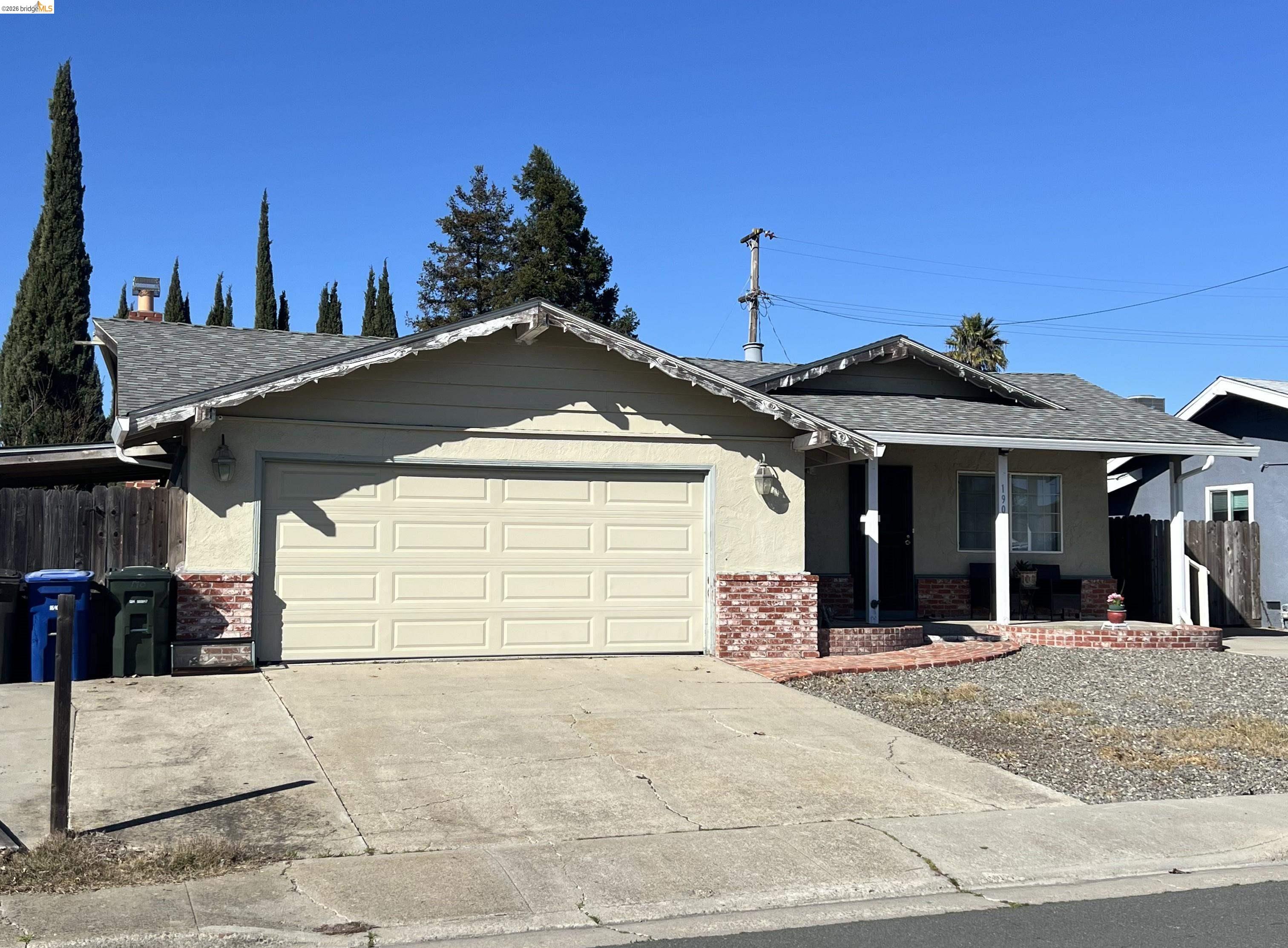 190 Tahoe Drive Rio Vista, CA 94571 - Photo 1 of 44 View of front of property with brick siding, a garage, roof with shingles, concrete driveway, and a porch