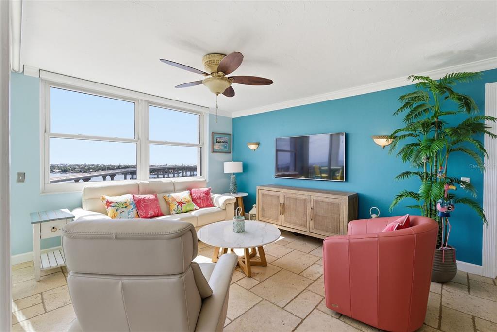 6265 Sun Boulevard, Unit 1204 St. Petersburg, FL 33715 - Photo 14 of 43 a living room with furniture and a large window