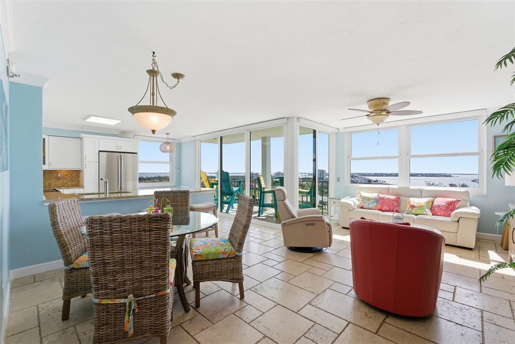 6265 Sun Boulevard, Unit 1204 St. Petersburg, FL 33715 - Photo 16 of 43 a dining room with furniture and wooden floor