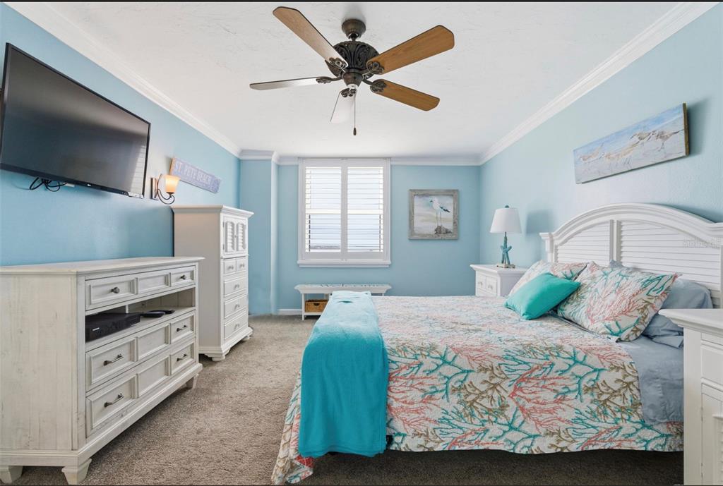 6265 Sun Boulevard, Unit 1204 St. Petersburg, FL 33715 - Photo 20 of 43 a bedroom with a bed and a flat screen tv