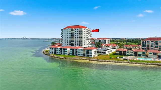 a view of a swimming pool with an outdoor seating