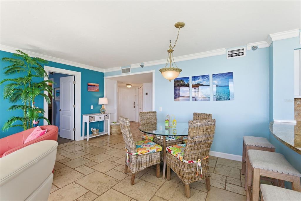 6265 Sun Boulevard, Unit 1204 St. Petersburg, FL 33715 - Photo 6 of 43 a dining room with furniture and window