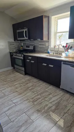 a bathroom with a sink toilet and mirror
