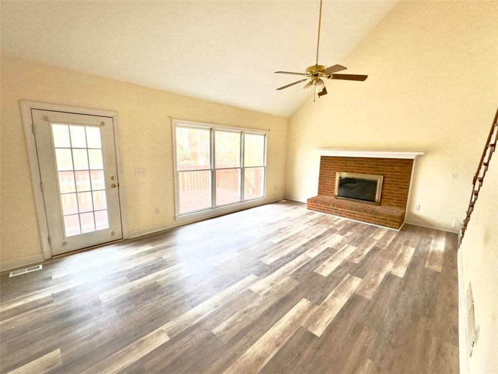 219 Deerhill Drive Bogart, GA 30622 - Photo 11 of 27 an empty room with windows and fireplace