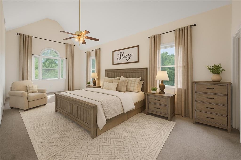 219 Deerhill Drive Bogart, GA 30622 - Photo 19 of 27 a bedroom with a large bed and a couch