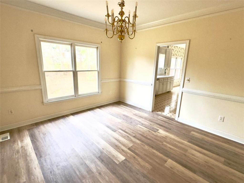 219 Deerhill Drive Bogart, GA 30622 - Photo 7 of 27 a view of empty room with wooden floor and fan