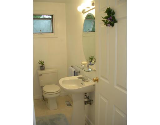 86 Maple Street Middleton, MA 01949 - Photo 16 of 24 a bathroom with a sink toilet and a mirror