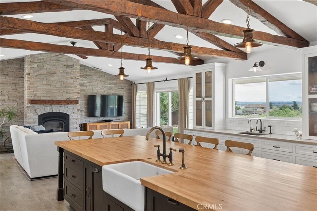 5565 High Ridge Road Paso Robles, CA 93446 - Photo 23 of 73 a view of a kitchen with a sink and a fireplace