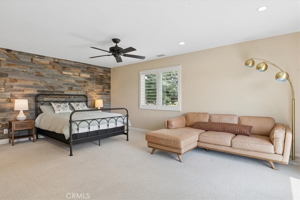 5565 High Ridge Road Paso Robles, CA 93446 - Photo 30 of 73 a bedroom with a bed couch and a chandelier