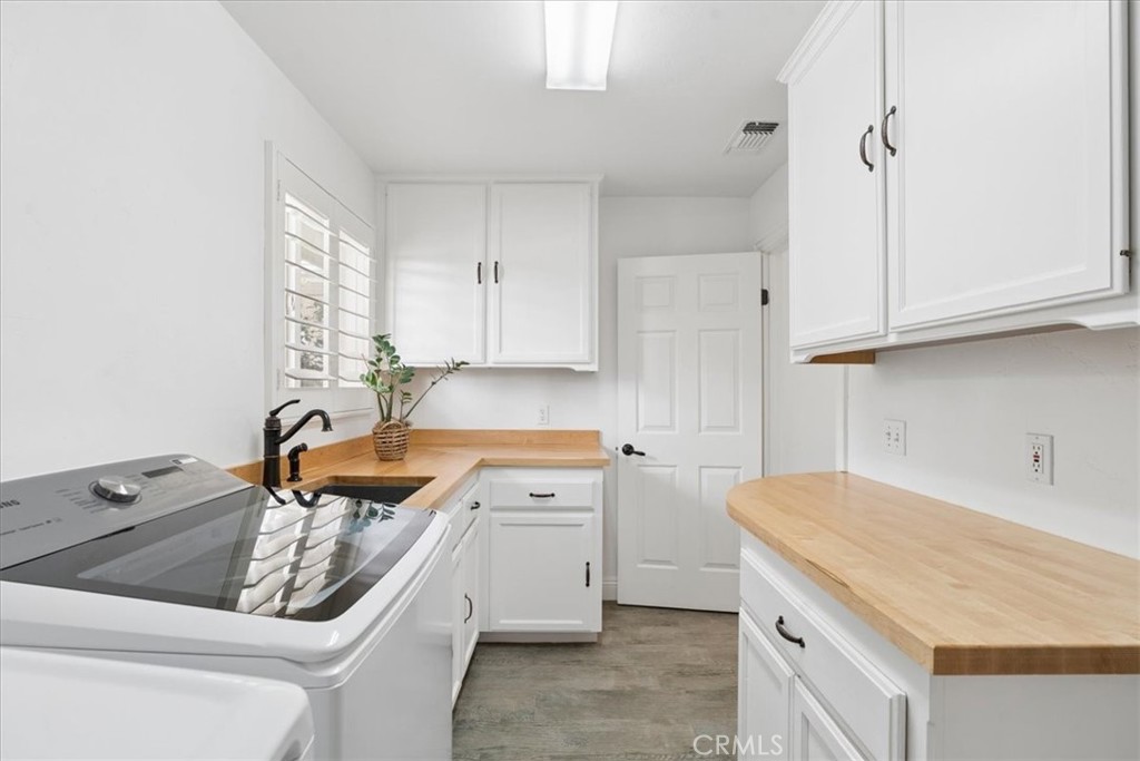 5565 High Ridge Road Paso Robles, CA 93446 - Photo 47 of 73 a kitchen with a sink stove and cabinets