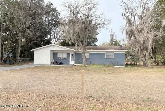a house with trees in front of it